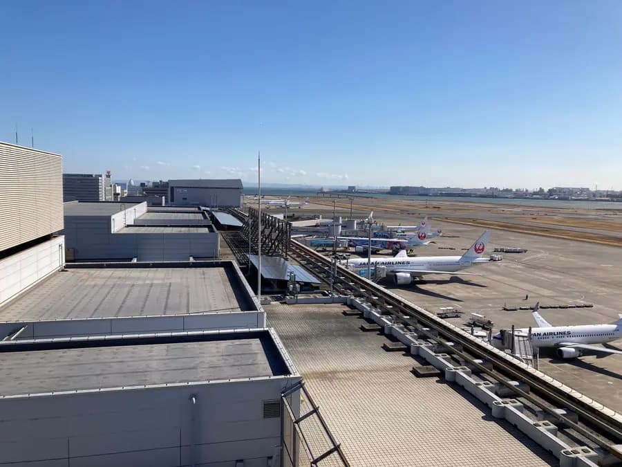 Commercial aircraft operating across a major airport terminal